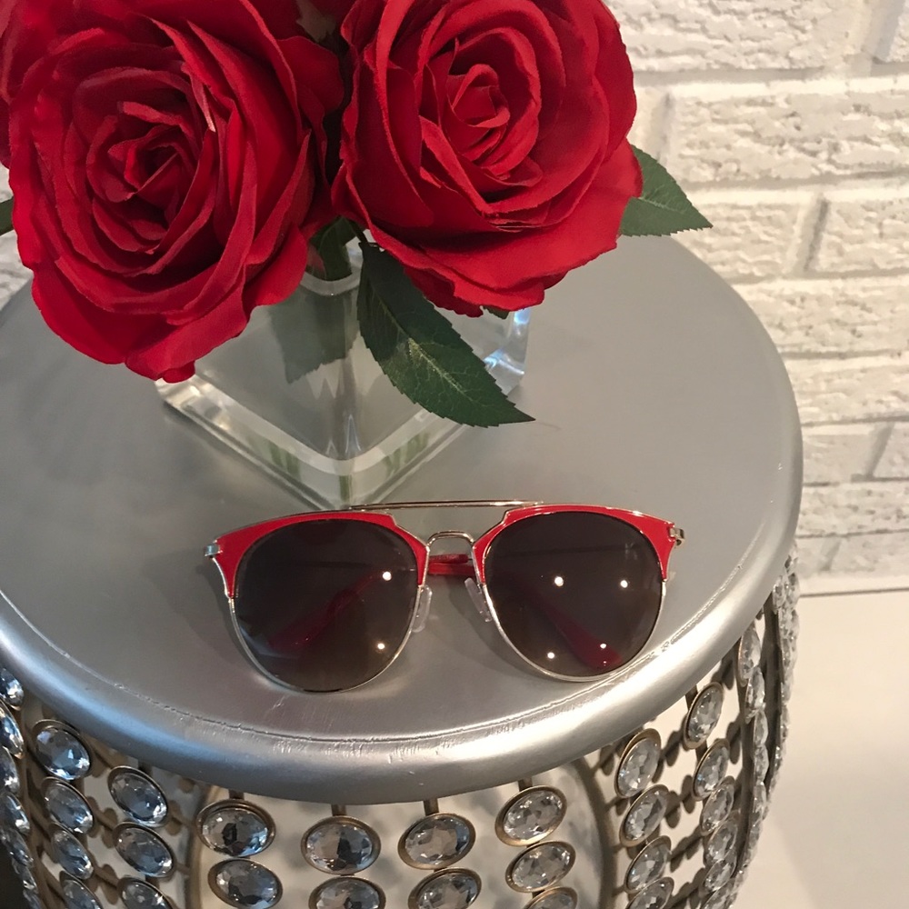 Red framed sunglasses.